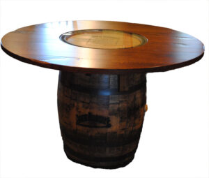 COUNTRY ROAD - Jack Daniels Barrel Table - Available dimensions: 54 inch Round or 60 inch Round, Made with authentic Jack Daniels whiskey barrels from their distillery in Tennessee. Barrels and Table top in 1/4 Sawn White Oak. Please call store for more details.